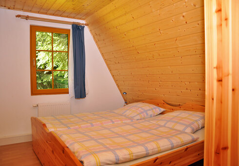 Blick in eine Finnhütte (Schlafzimmer)
